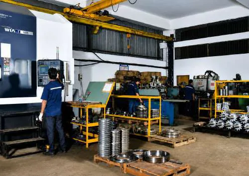 Machine shop floor with VMC and turned rings